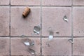 Broken glass on the floor, alcohol abuse