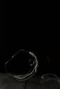 Broken glass goblet. Lies on black boards. Shot on a black background Royalty Free Stock Photo