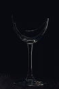 Broken glass goblet. Stands on black boards. Shot on a black background Royalty Free Stock Photo