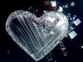 A broken glass heart with a network of cracks Royalty Free Stock Photo