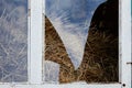 Broken glass in an old window of the hayloft Royalty Free Stock Photo