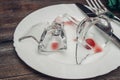 broken glass on plates kitchenware table setting tableware Royalty Free Stock Photo