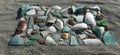 broken glass on sand in beach, pieces of glass Royalty Free Stock Photo