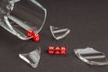 Broken glass of glass scattered around, next to red cubes on which the letters are not war