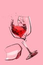 Broken glass with a splashing red wine on a pink background, 3d illustration Royalty Free Stock Photo