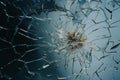 a broken glass window with a bullet hole in it Royalty Free Stock Photo