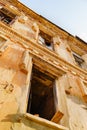 broken glass in windows of an old ruined building. demolition of houses. Royalty Free Stock Photo