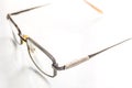 Broken glasses with the coiled taped handle on a bright background Royalty Free Stock Photo