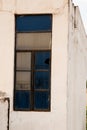 Broken glasses of an outdoor window of a building in a town Royalty Free Stock Photo