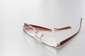 Broken glasses on a white background. Broken earband from the glasses Royalty Free Stock Photo