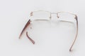 Broken glasses on a white background. Broken earband from the glasses Royalty Free Stock Photo