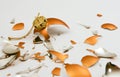 Broken golden ornament on a white background