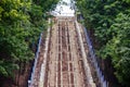 Broken Grand staircase leading to the hill. Repair steps concrete stairs fenced Royalty Free Stock Photo