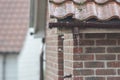 Broken gutter missing a downpipe. House guttering repair leaking Royalty Free Stock Photo