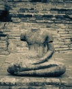 Broken headless Buddha