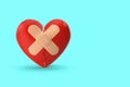 Broken heart with bandage plaster on blue background Royalty Free Stock Photo