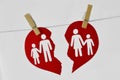 Broken heart with familiy hanging on clothesline - Divorce and broken family concept Royalty Free Stock Photo