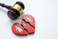 A broken heart and a gavel as a symbol of divorce, alimony and custody.