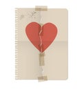 Broken heart painted on the sheet of a notebook and repaired wit Royalty Free Stock Photo