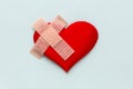 Broken heart patched with a patch. Royalty Free Stock Photo