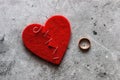 Broken heart sewn with thread and wedding ring divorce concept Royalty Free Stock Photo