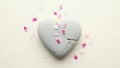 Broken Heart-Shaped Stone with Petals Royalty Free Stock Photo