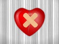 Broken heart on wooden backfound Royalty Free Stock Photo