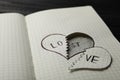 Broken heart with words LOVE and LOST in notebook on table. Relationship problems concept Royalty Free Stock Photo