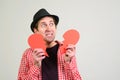 Broken hearted man. Valentines day. Man holding broken heart in his hands. Unhappy love concept. Heartbroken boyfriend Royalty Free Stock Photo