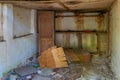 Broken interior of a village house in the Chernobyl Exclusion Zone in the Ukraine