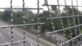 Broken iron wire fence over highway Royalty Free Stock Photo