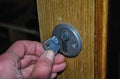 broken key in the door lock. part of a broken key in hand Royalty Free Stock Photo