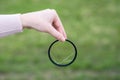Broken lens filter in hand. Cracked photo-filter Royalty Free Stock Photo