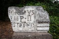 Broken marble stone with latin inscription on display at the Forum, Rome Royalty Free Stock Photo