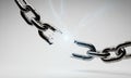 Broken Metal Chain with Electrical Arcs on a White Background Concept of Breaking Free and Royalty Free Stock Photo