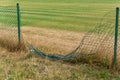 Broken metal chain fence