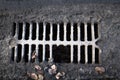Broken drain grate with mud Royalty Free Stock Photo