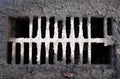 Broken drain grate with mud Royalty Free Stock Photo