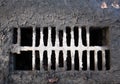 Broken drain grate with mud