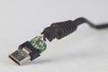 Broken Micro USB cable plug showing circuitboard inside Royalty Free Stock Photo