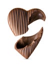 Broken milk chocolate heart shaped candy isolated on the white background Royalty Free Stock Photo