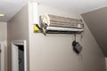 Broken mini split air conditioner system on wall