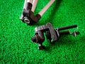 Broken mobile tripod isolated on green background