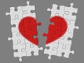 Broken mosaic from puzzles with symbol of heart