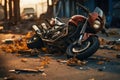 Broken motorcycle after accident lying on the street