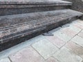 Broken nosing of an riser of an granite finished stair riser and treads which have three grooves for anti slippery purpose and