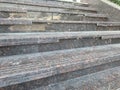 Broken nosing of an riser of an granite finished stair riser and treads which have three grooves for anti slippery purpose and