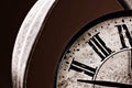 Broken old analog clock with glass and metal frame on wooden table, broken structure Royalty Free Stock Photo