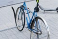 Broken old bike. The bent wheel. Attached to the rack Royalty Free Stock Photo