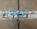 Broken old blue pvc pipe under broken old concrete ground